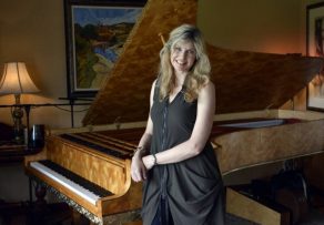 Busy calendar: Fiona Joy with her much-loved Stuart & Sons concert grand piano. Photo - PETER GLEESON