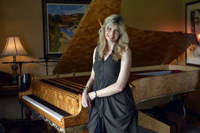 Busy calendar: Fiona Joy with her much-loved Stuart & Sons concert grand piano. Photo - PETER GLEESON